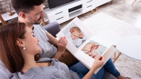 Mom and Dad looking at photo album