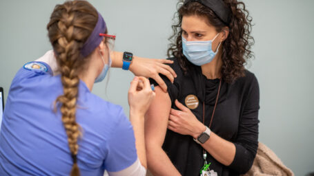 Dr. Vicki Flynn receiving the COVID-19 vaccination
