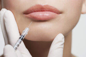 woman receiving botox on her lips