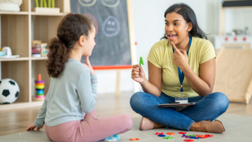 speech therapist working with a child.