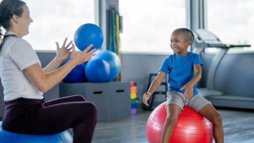 kid working with a physical therapy