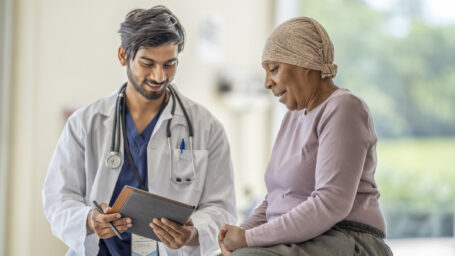 Cancer patient talking with doctor