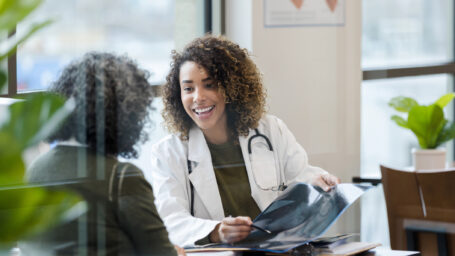 Doctor showing x-ray results to patient