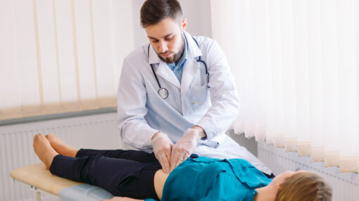 A doctor checking a patient's liver