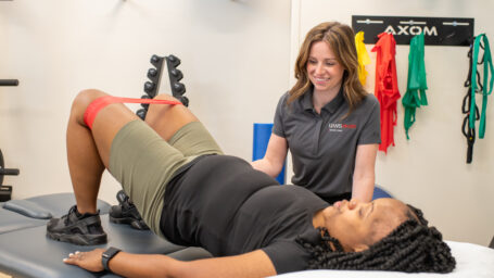 pt working with a client on pelvic exercises