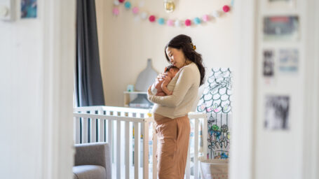 postpartum mom holding with baby