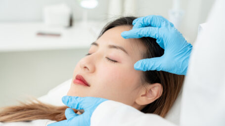 cosmetic surgery, beauty, Surgeon or beautician touching woman face, surgical procedure that involve altering shape of eye, medical assistance, eyelid surgery, double eyelid, big eyes, ptosis