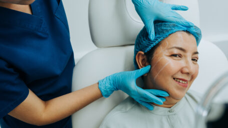 Pre-surgery facial contour markings by professional in aesthetic treatment setting