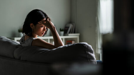 woman sitting alone in the dark