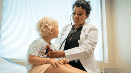 Dr. C'Asia James with a patient in El Dorado