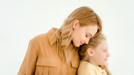 Mother embracing young daughter