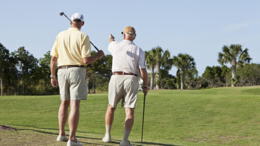 Senior men playing golf