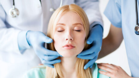 Woman getting a necklift consultation.