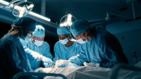 Surgeons operating on a patient