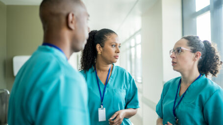 A team of nurses discussing a care plan