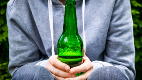 boy holding a beer