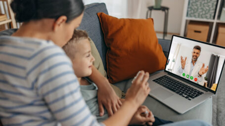 a mom and her son on a virtual doctor appt