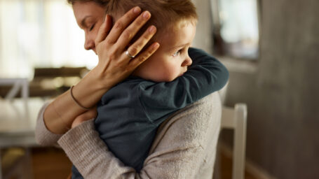 mom hugging her son