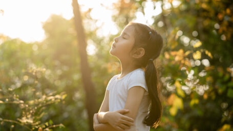 a little girl relaxing in nature