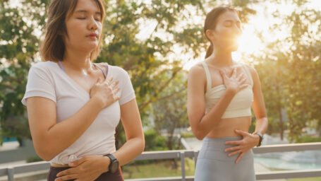 two teens doing breathing exercise