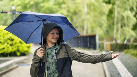 teen boy in the rain